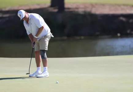 Canon Claycomb putts during the SEC Men's Golf Championships
