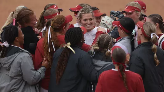 Montana Fouts celebrates with her teammates after throwing a no-hitter vs. South Carolina (April 8, 2023)