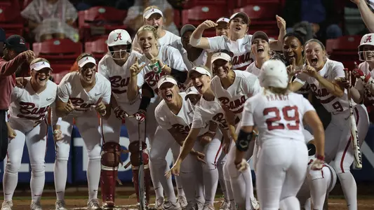 Alabama softball players await Ashley Prange at home plate after a home run vs. Missouri in the SEC Tournament (May 10, 2023)