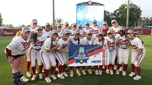 Alabama Softball team posing on the field after winning the Super Regional round vs. Northwestern (May 28, 2023)