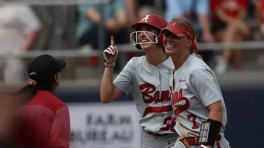 Jenna Johnson and Bailey Dowling smiling after Johnson's go-ahead home run at Ole Miss (May 6, 2023)