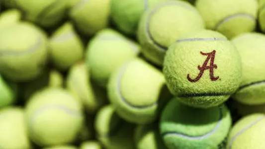 Tennis Balls, one with a script A printed on it
