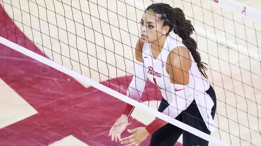 Micah Gryniewicz waits at the net for the ball.