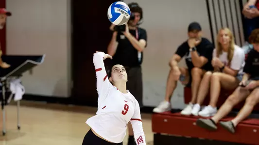 Sami Jacobs hits the ball over the net.