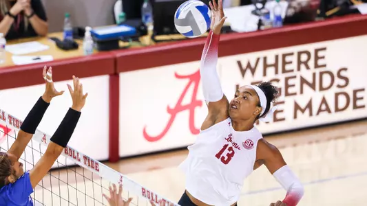 Alyiah Wells blocks the ball.