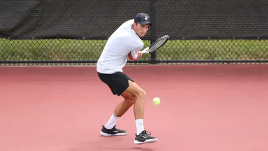 Filip Planinsek returns a ball