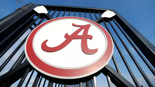 Dock gate with a Script A logo hung on the gate