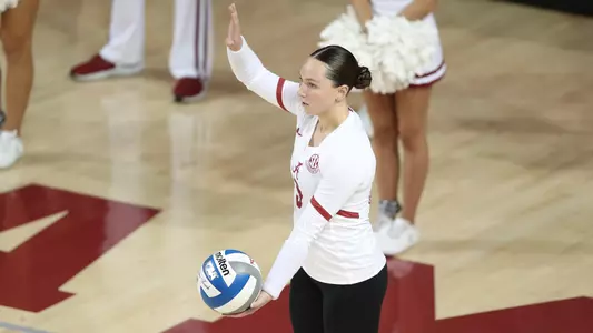 Sydney Gholson preparing to serve.
