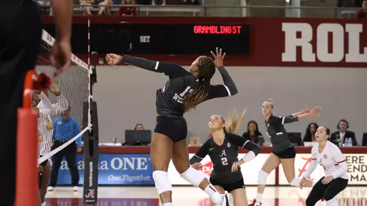 Alyiah Wells goes up for a spike.