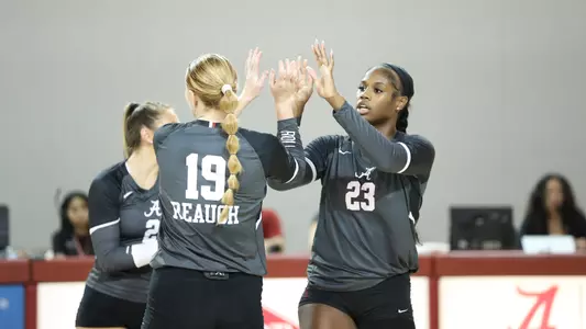 Chaise Campbell high fives Kendyl Reaugh during match vs. Grambling (Sept. 16, 2023)
