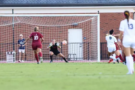 Coralie Lallier makes a diving save