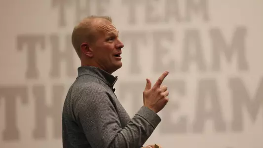 Kalen DeBoer speaking to the team