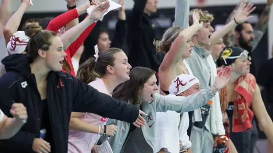 Swimming and diving team cheering