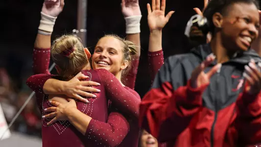 Lily Hudson hugs teammate
