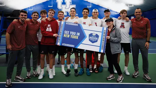 men's tennis with advancing sign for ITA Indoor championships