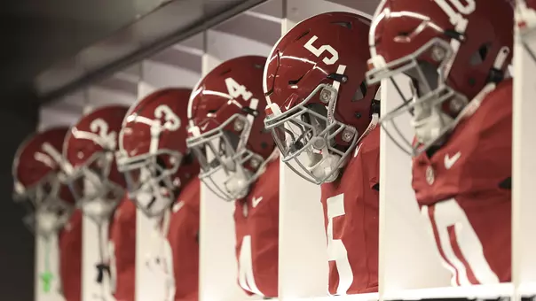 Uniforms lined up in the locker room
