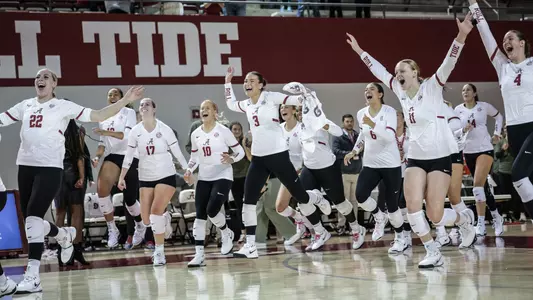 Alabama volleyball players rush the court following a win over Mississippi State (Nov. 15, 2024)