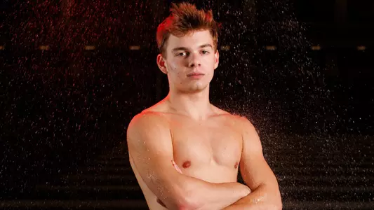 Colten Cryer in front of water