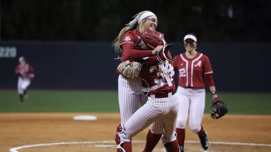Alabama pitcher celebrates no hitter against Villanova with Marlie Giles.