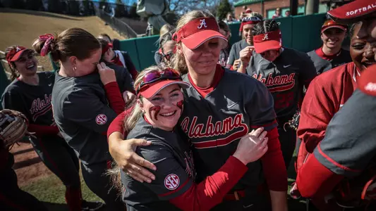 Kat Grill (32) and Bailey Dowling (7) hug during Grill's senior day ceremony vs. Southern Indiana (Feb. 18, 2024)