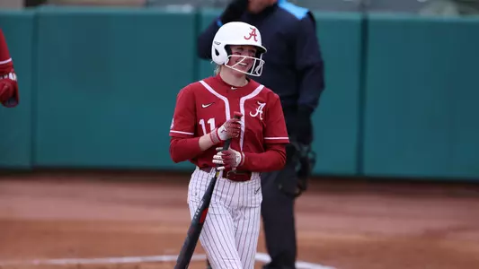 Alabama softball player Larissa Preuitt smiles on the field against UVA.