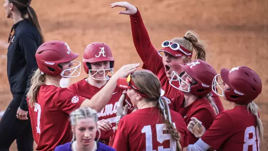 Alabama softball players celebrate a run-rule win over UNA (Feb. 21, 2024)