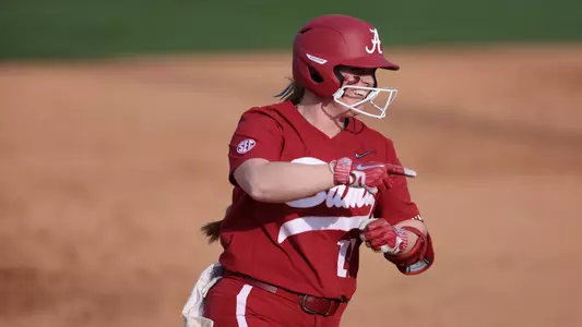 Alabama softball player Emma Broadfoot runs across the bases after hitting a home run.