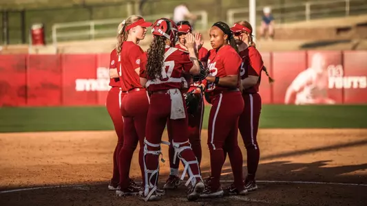 Alabama softball team huddle vs. UNA (Feb. 21, 2024)
