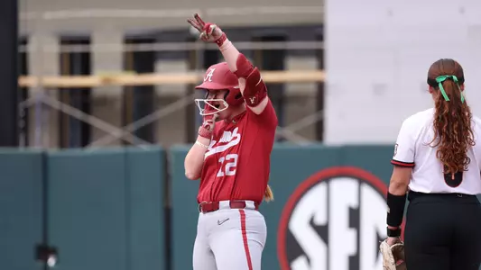 Alabama softball player Emma Broadfoot celebrates her hit against UGA.