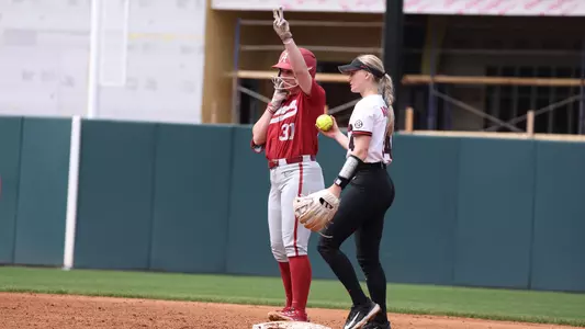 Alabama softball player Kenleigh Cahalan celebrates making it on base against the Bulldogs.