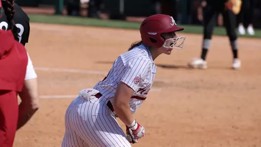 Softball transfer Kendal Clark (15) celebrates hitting her first triple at Alabama against Virginia Tech.