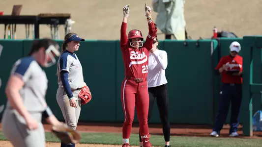 Alabama softball player Kali Heivilin celebrates home run.
