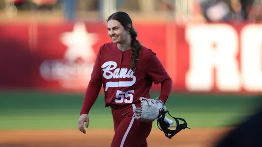 Alabama softball pitcher Alea Johnson smiling in the circle.