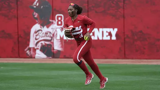 Alabama softball player Kristen White in centerfield against South Alabama.