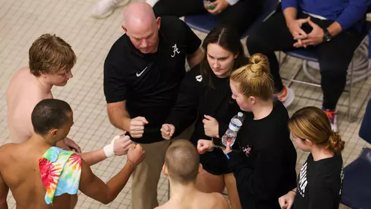 Divers in team huddle