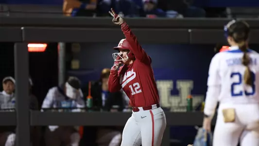 Alabama softball player Emma Broadfoot (12) celebrates hitting a home run against Kentucky.