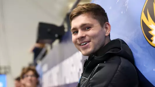 Jake Marcum smiles on deck