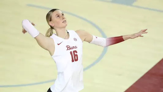 Alabama volleyball player Sophia Agee serves the ball.