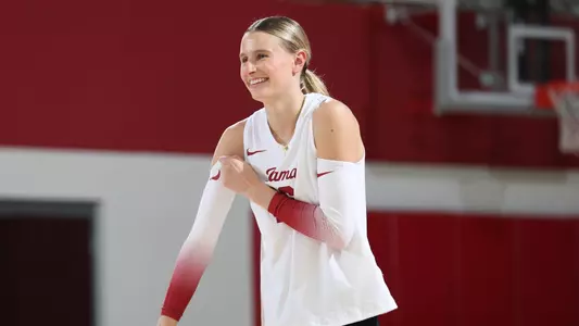 Alabama volleyball player Sophie Agee smiling on the court.