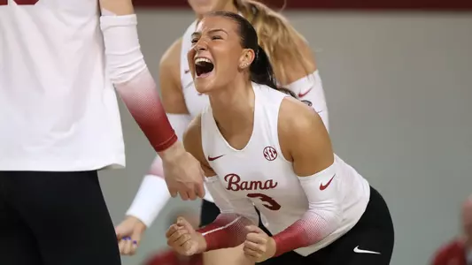Alabama softball player Allison Berent celebrates on the court.