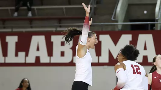 Alabama softball player Allison Berent celebrating on the court.