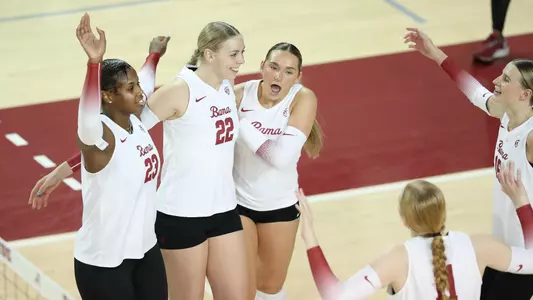Alabama volleyball player Kyla Dunaway smiles with teammates.
