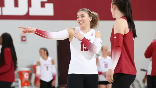 Alabama volleyball player Lily Hopkins smiling on the court.