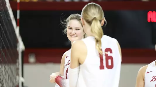 Alabama volleyball player Jordyn Towns smiling at teammate Sophie Agee.
