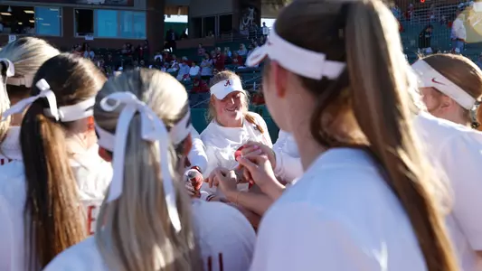 Alabama softball player KJ Haney (24) in the huddle with her teammates.