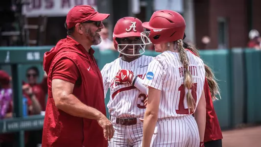 Patrick Murphy talks with Kristen White (3) and Larissa Preuitt (11) in a timeout vs. Southeastern (May 19, 2024)