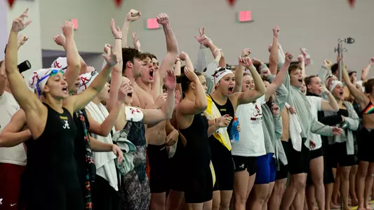 Swimming and diving team cheering