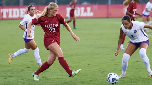 Leah Kunde kicks the ball