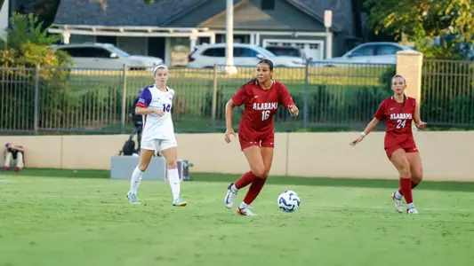Nedya Sawan dribbles the ball down the field