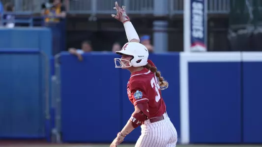 Marlie Giles (34) rounds second after hitting a home run vs. Duke at the Women's College World Series (May 31, 2024)